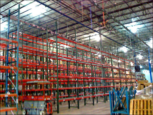 Pallet Rack System Installation in Progress for Improved Efficiencies in a Warehouse Environment