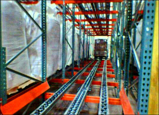 12-Deep Pallet Flow Storage System 12-Deep Pallet Flow Storage System Installed in a Warehouse Environment